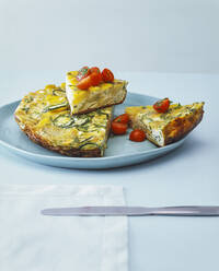 Close-up of tortilla slices in plate on table - PPXF00260