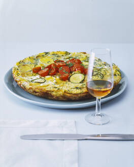 Close-up of tortilla with wine on table against white background - PPXF00265