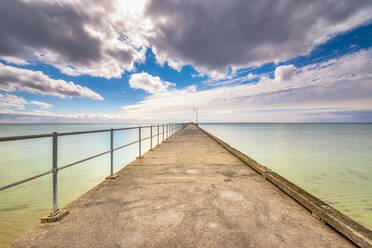 Dromana Pier over sea against cloudy sky, Victoria, Australia - SMAF01299