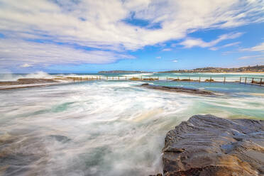 North Curl Curl Rockpool at beach against sky, Sydney, Australia - SMAF01334