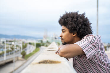 Young hipster on viewpoint, Barcelona, Spain - AFVF03819