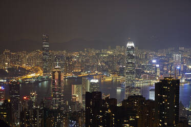 View at night of central Hong Kong and Victoria Harbour from Victoria Peak, looking toward Kowloon in background, Hong Kong, China, Asia - RHPLF03631