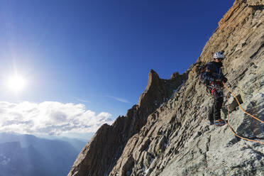 Climber on south ridge of Dent Blanche, 4357m, Valais, Swiss Alps, Switzerland, Europe - RHPLF03637