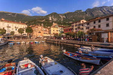 View of boats in Malcesine Harbour by the Lake, Malcesine, Lake Garda, Veneto, Italian Lakes, Italy, Europe - RHPLF04259