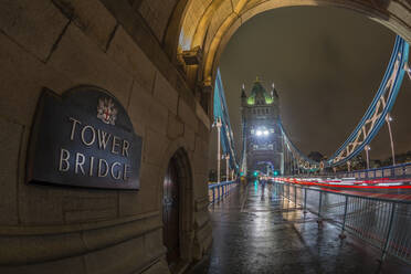 Fisheye view of traffic trail lights on Tower Bridge at night, Southwark, London, England, United Kingdom, Europe - RHPLF04372