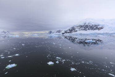 Atmospheric iceberg, mountain and glacier reflections, Neko Harbour, Andvord Bay, Graham Land, Antarctic Peninsula, Antarctica, Polar Regions - RHPLF04411