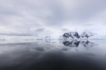 Atmospheric iceberg, mountain and glacier reflections, Neko Harbour, Andvord Bay, Graham Land, Antarctic Peninsula, Antarctica, Polar Regions - RHPLF04412