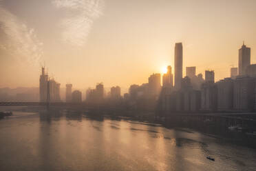 Chongqing city skyline at dawn, with the view of the Yuzhong peninsula CBD and Jialing River, Chongqing, China, Asia - RHPLF04520