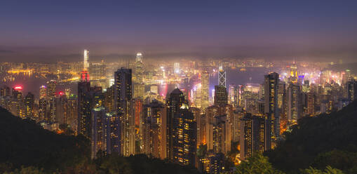 Hong Kong city skyline at night, showing the Central and Kowloon area, viewed from Victoria Peak, Hong Kong, China, Asia - RHPLF04524