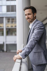 Portrait of confident businessman in the city - DIGF08106