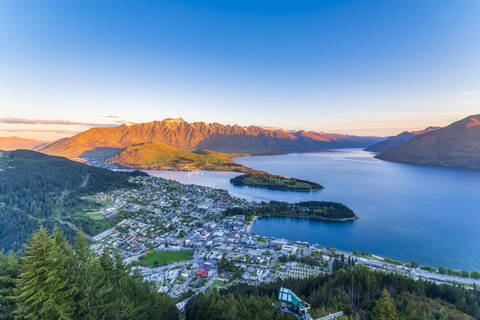 View of town from mountain against sky at Queenstown, South Island, New Zealand stock photo