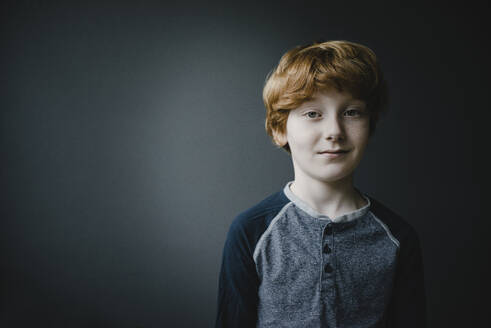 Portrait of smiling redheaded boy - KNSF06244
