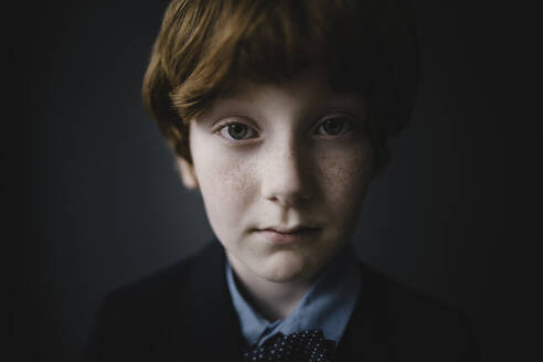Portrait of sad boy with freckles - KNSF06306