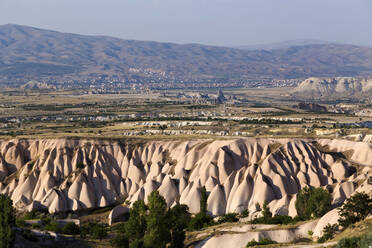 Scenic view of landscape against clear sky during sunny day, Cappadocia, Turkey - KNTF03133