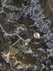 Aerial view of hot air balloon flying at Goreme National Park, Cappadocia, Turkey - KNTF03135