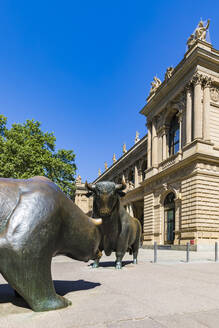 Bear and bull statue on footpath against clear blue sky in Frankfurt, Germany - WD05443