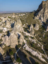 Aerial view of Uchisar castle against clear blue sky at Cappadocia, Turkey - KNTF03159