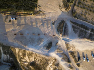 Drone shot of horses on road at Goreme, Cappadocia, Turkey - KNTF03193