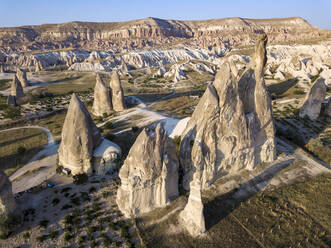 Drone shot of Dove complex monastery against clear sky at Goreme, Cappadocia, Turkey - KNTF03197