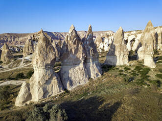 Aerial view of Dove complex monastery against clear blue sky at Goreme National Park, Cappadocia, Turkey - KNTF03203