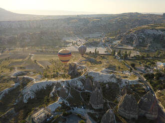 Drone view of hot air balloons flying at Goreme National Park, Cappadocia, Turkey - KNTF03221