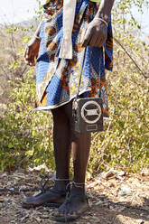 Ndengelengo man, holding radio on his hands, Garganta, Angola. - VEGF00537