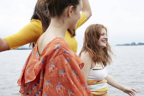 Friends having fun, walking at he river stock photo