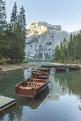 Rowboats moored at Braies lake against mountain, Italy - WPEF01834