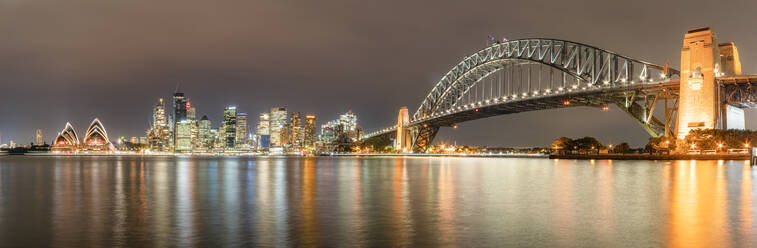 Panoramic shot of illuminated Sydney Harbor Bridge over river at Sydney, Australia - SMAF01418