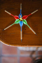 Close-up of darts on wooden table - LJF00815