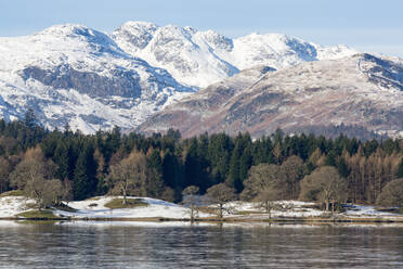 Looking towards the north end of Windermere near Ambleside, with rugged snow covered mountains including Helvellyn, Lake District National Park, UNESCO World Heritage Site, Cumbria, England, United Kingdom, Europe - RHPLF04747