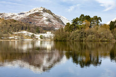 A perfect reflection of snow covered mountains and sky in the still waters of Grasmere, Lake District National Park, UNESCO World Heritage Site, Cumbria, England, United Kingdom, Europe - RHPLF04748