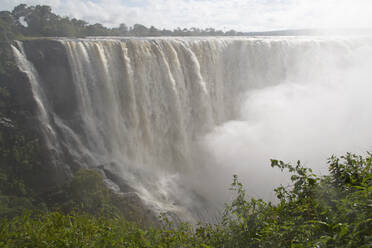 The River Zambezi crashes over the Victoria Falls waterfall (Mosi-oa-Tunya), UNESCO World Heritage Site, on the border of Zimbabwe and Zambia, Africa - RHPLF04762