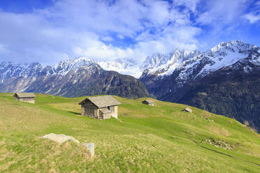 Traditional huts with Pizzo Badile in the background, Soglio, Val Bregaglia (Bregaglia Valley), Graubunden, Switzerland, Europe - RHPLF05416