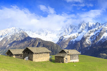 Traditional huts with Masino-Bregaglia group in the background, Soglio, Val Bregaglia, Graubunden, Switzerland, Europe - RHPLF05417