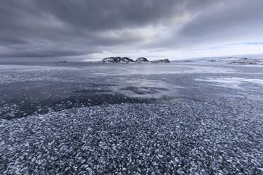 Brash ice and grease ice, strip of blue sky, Torgersen Island, glaciers of Anvers Island, Antarctic Peninsula, Antarctica, Polar Regions - RHPLF05509