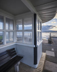 Late afternoon view through a shelter above steps to the beach, Exmouth, Devon, England, United Kingdom, Europe - RHPLF06315