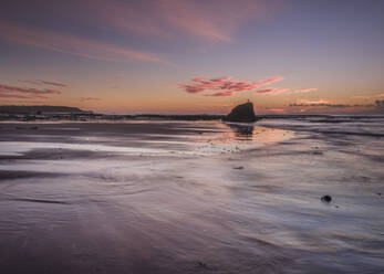 Vivid dawn cloud formation and wet sand, Sandy Bay, Orcombe Point, Exmouth, Devon, England, United Kingdom, Europe - RHPLF06340