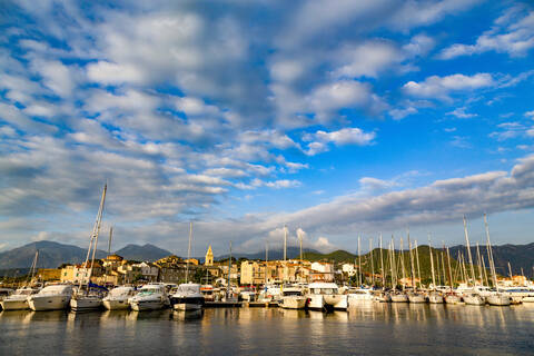 Boats moored in the small harbour of Saint Florent in northern Corsica, France, Mediterranean, Europe stock photo