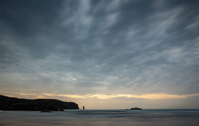 Am Buachaille sea stack at sunset, Sandwood Bay, Sutherland, Scotland, United Kingdom, Europe - RHPLF06502
