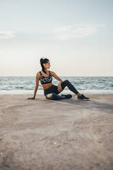 Woman during workout on a pier - OYF00007