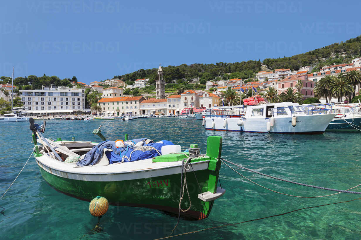 Boats and fishing nets at the pier of the town at sunset, Bol, Brac island,  Split-Dalmatia county, Croatia, Europe stock photo