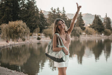 Young blond woman at a lake - ACPF00616