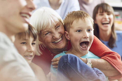 Three generations family having fun at home - MCF00250