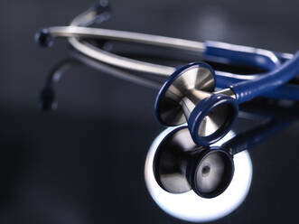 Close-up of stethoscope on table in hospital - ABRF00425