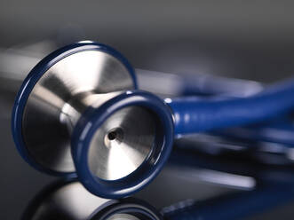 Close-up of stethoscope on table - ABRF00427