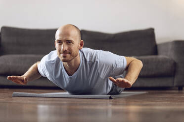 Man doing yoga at home - MCF00305