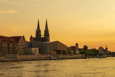 Saint Peter's Cathedral and buildings by Danube river against sky during sunset, Regensburg, Germany - LBF02674