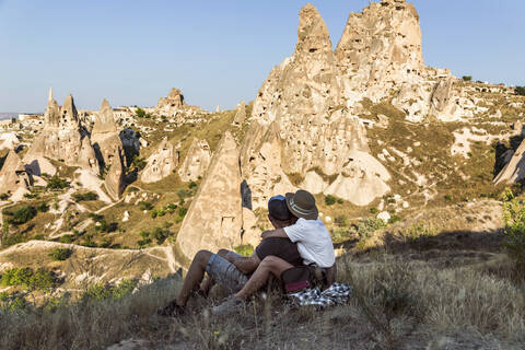 Couple looking to Uchisar castle, Cappadocia, Turkey stock photo