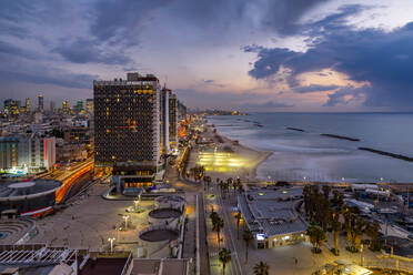 Elevated view of the beaches and hotels at dusk, Jaffa visible in the background, Tel Aviv, Israel, Middle East - RHPLF07070